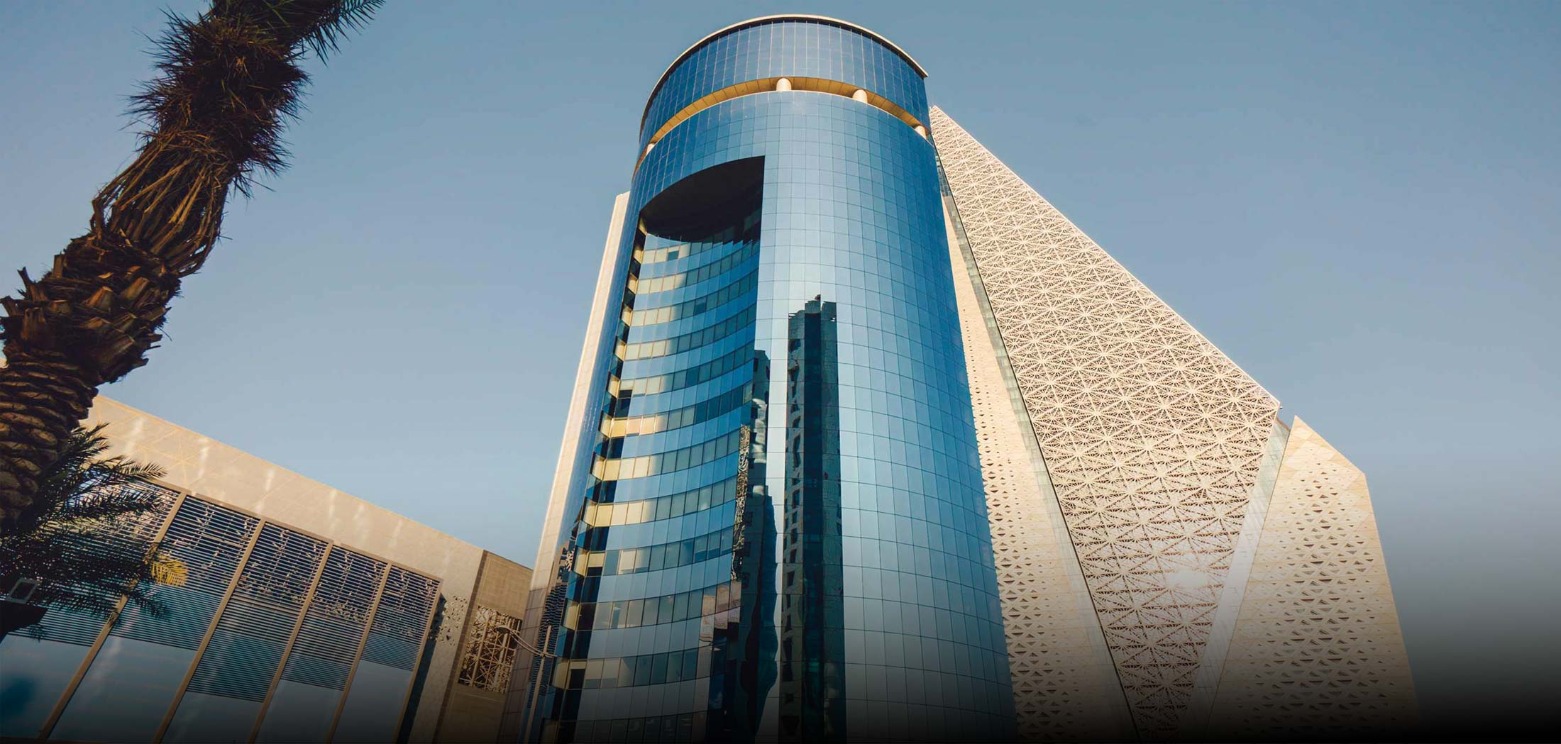 Modern commercial tower representing Al-Faisal Holding real estate sector Sector